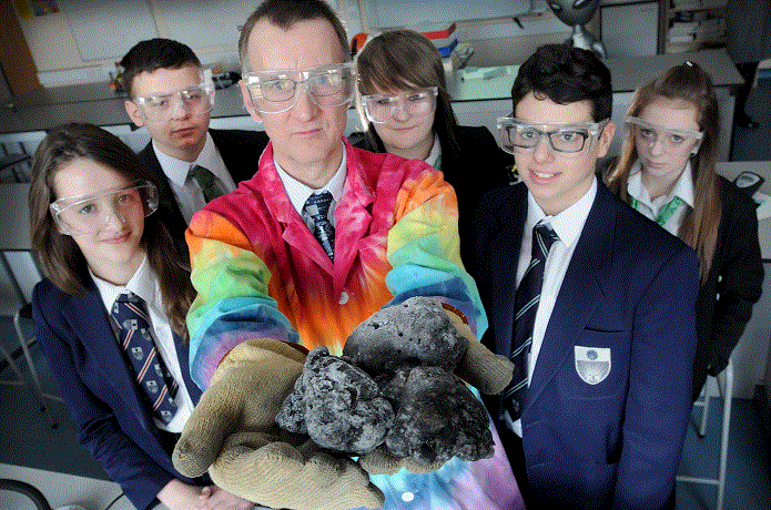 Conor Davies shows the comet to pupils