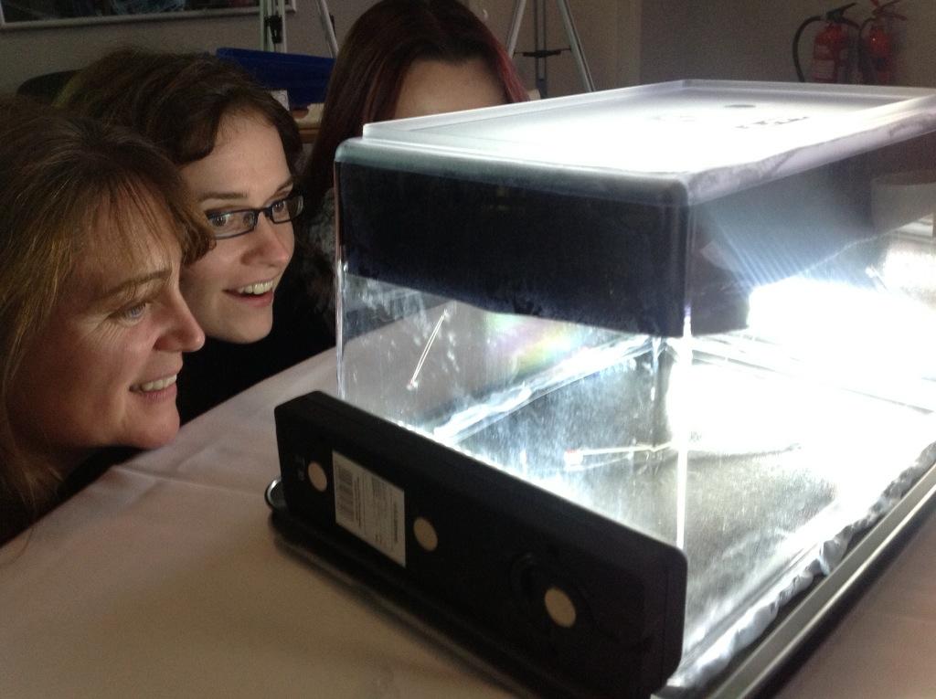 Delegates from Science Centres looking for particles in their home-made cloud chamber